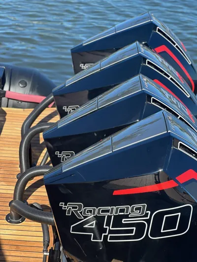 New 2025 Skipper 42 Quad 450r Yacht Photos Pics Four powerful Racing 450 outboard motors on a Skipper-BSK 42NC, 2025 model, by the water.