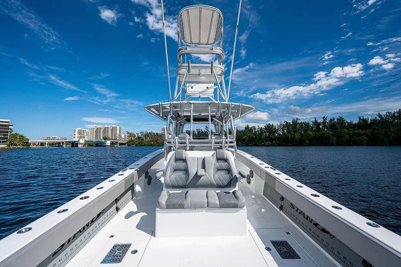 No Woke Zone Yacht Photos Pics 2019 Freeman 37 boat on calm water with clear blue sky.
