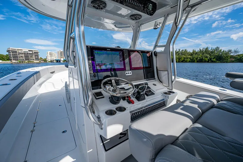 No Woke Zone Yacht Photos Pics 2019 Freeman 37 boat cockpit with modern navigation system and luxurious seating.