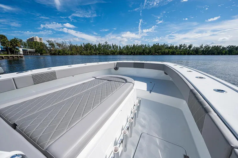 No Woke Zone Yacht Photos Pics 2019 Freeman 37 boat with spacious deck and seating, on a calm lake.