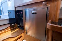 Interior of 2022 Nimbus T11 yacht with stainless steel panel and control system.