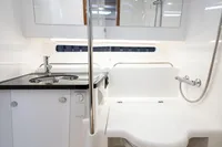 Modern bathroom in 2022 Nimbus T11 yacht with sleek fixtures and compact design.