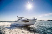 2022 Nimbus T11 boat cruising on sunny ocean waters.