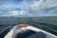 Nimbus T11 2x350 boat on open sea under cloudy sky, 2022 model.