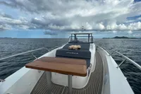 Nimbus T11 2x350 boat on open sea, wooden deck table, cloudy sky, 2022 model.