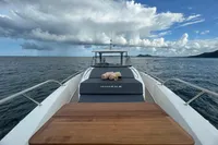 Luxurious Nimbus T11 yacht on open sea, featuring sleek design and wooden deck, 2022 model.