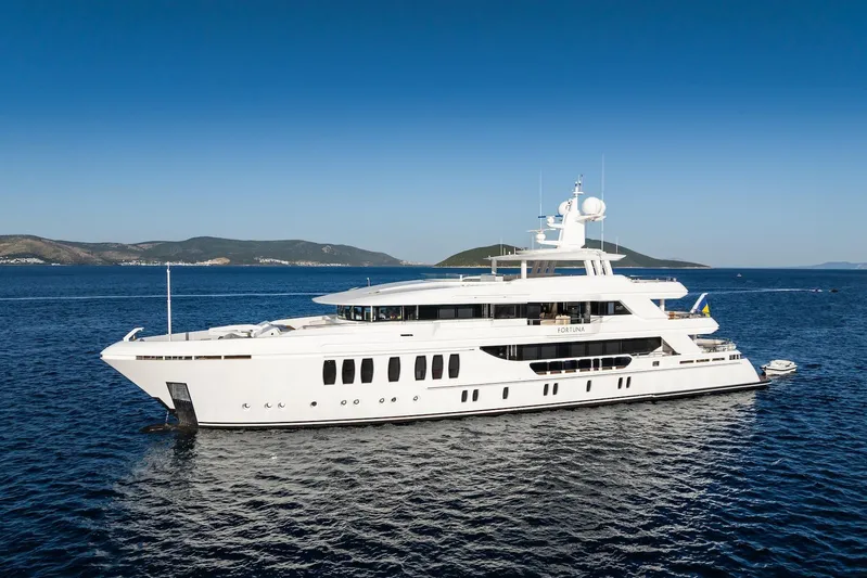 Fortuna Yacht Photos Pics Luxury CMB Yachts CMB 47, 2022 model, cruising on open sea with scenic backdrop.