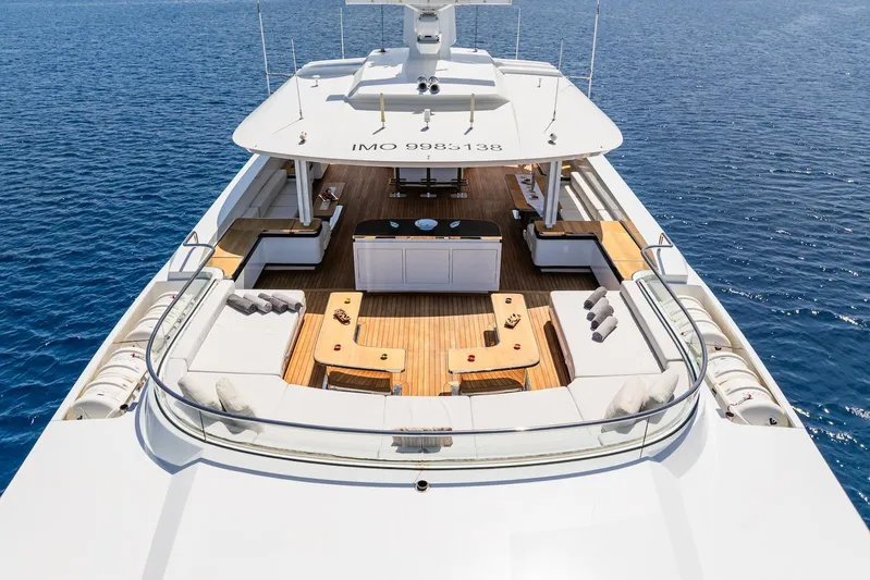 Fortuna Yacht Photos Pics Luxurious 2022 CMB Yachts CMB 47 with spacious deck and elegant seating on open sea.