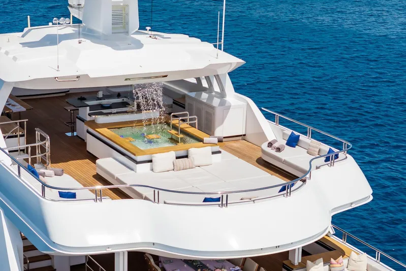 Fortuna Yacht Photos Pics Luxurious 2022 CMB Yachts CMB 47 with jacuzzi on deck, surrounded by ocean.