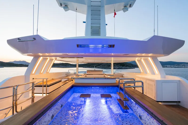 Fortuna Yacht Photos Pics Luxurious 2022 CMB Yachts CMB 47 with illuminated pool and elegant deck design.