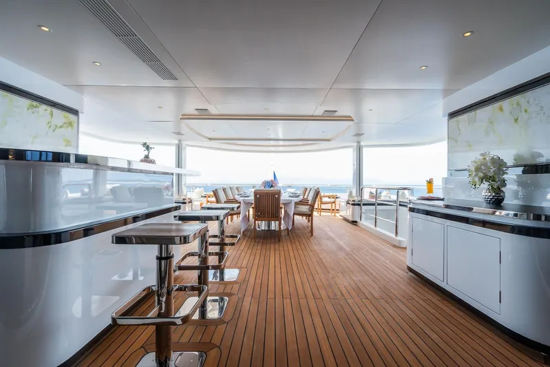 Fortuna Yacht Photos Pics Luxurious 2022 CMB Yachts CMB 47 interior with elegant dining and bar area.