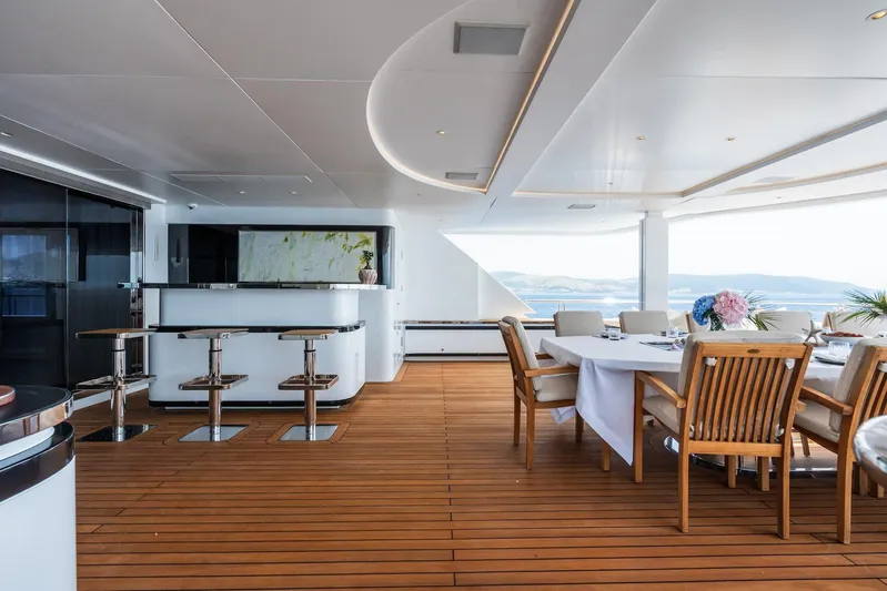 Fortuna Yacht Photos Pics Luxurious 2022 CMB Yachts CMB 47 deck with elegant dining and bar area.