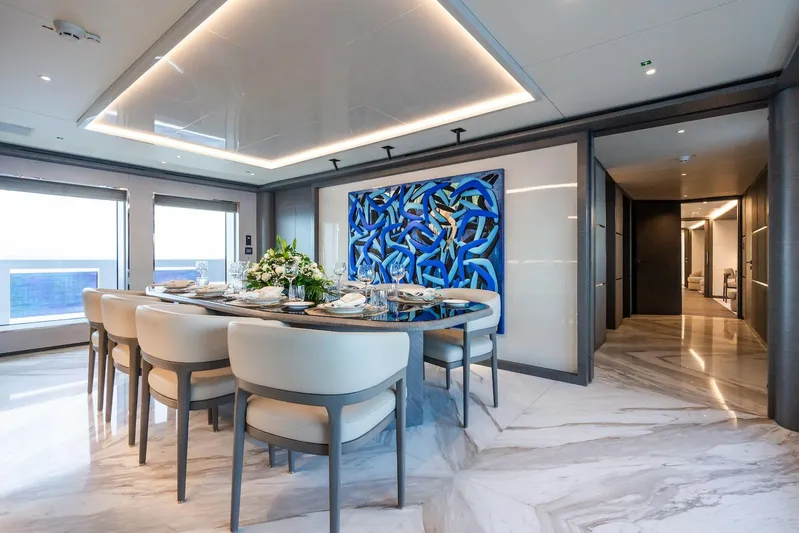 Fortuna Yacht Photos Pics Luxurious dining area on 2022 CMB Yachts CMB 47, featuring elegant decor and modern art.