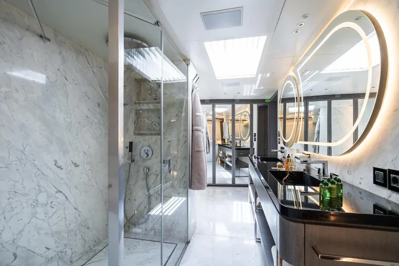 Fortuna Yacht Photos Pics Luxurious bathroom on 2022 CMB Yachts CMB 47, featuring marble walls and modern fixtures.