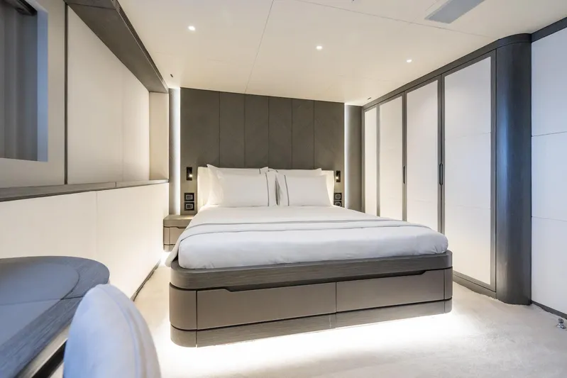 Fortuna Yacht Photos Pics Luxurious bedroom interior on 2022 CMB Yachts CMB 47, featuring modern design and ambient lighting.