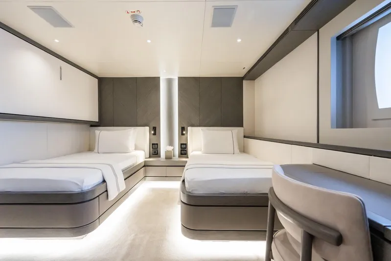 Fortuna Yacht Photos Pics Luxurious twin bedroom on 2022 CMB Yachts CMB 47, featuring modern design and ambient lighting.