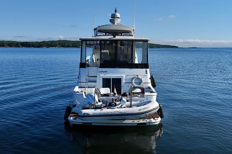 One Last Time II Yacht Photos Pics 2004 Carver 444 Cockpit Motor Yacht on calm water, rear view.