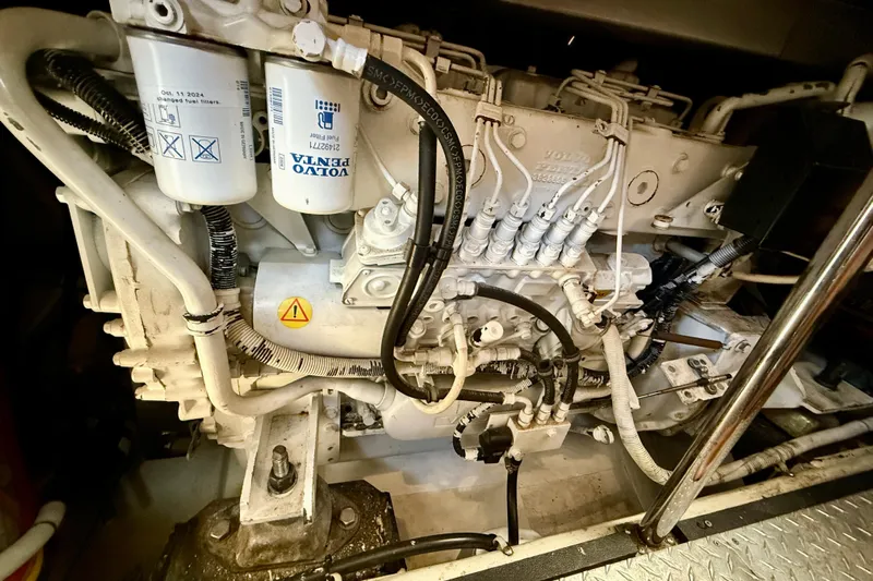 One Last Time II Yacht Photos Pics Engine of 2004 Carver 444 Cockpit Motor Yacht with Volvo Penta components.