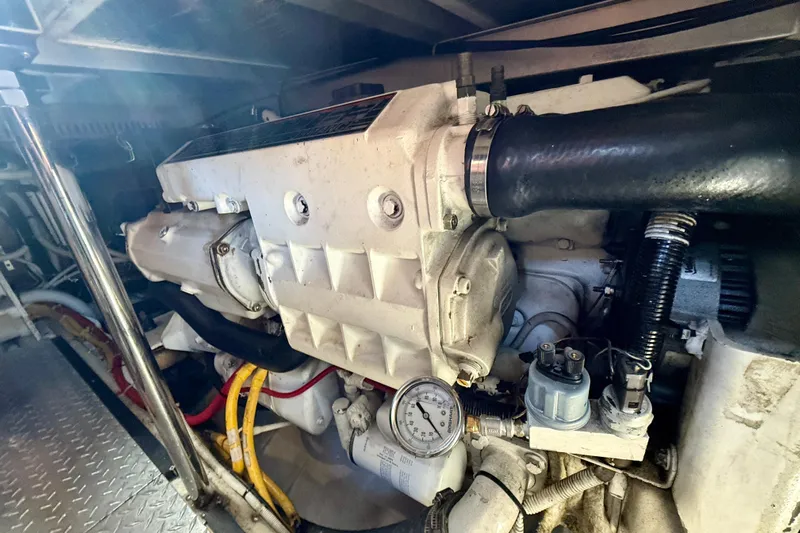 One Last Time II Yacht Photos Pics Engine room of 2004 Carver 444 Cockpit Motor Yacht, showcasing mechanical components.