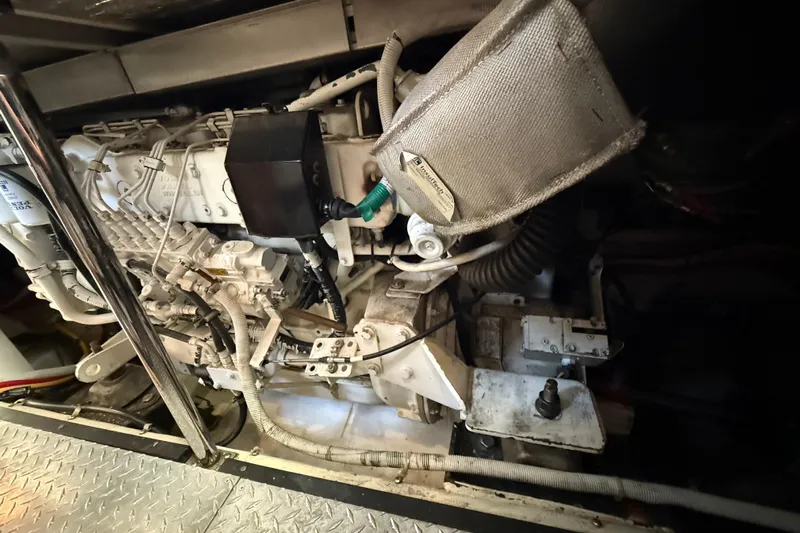 One Last Time II Yacht Photos Pics Engine room of 2004 Carver 444 Cockpit Motor Yacht, showcasing mechanical components.