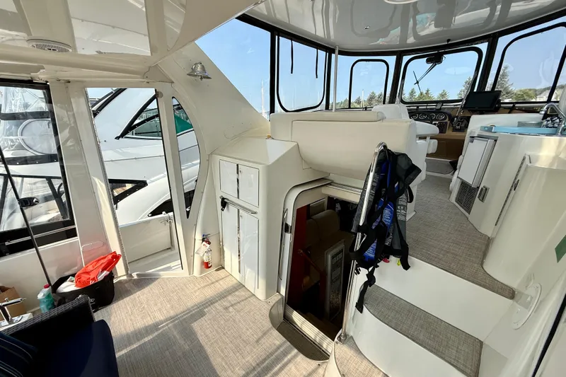 One Last Time II Yacht Photos Pics Interior of 2004 Carver 444 Cockpit Motor Yacht with helm and seating area.