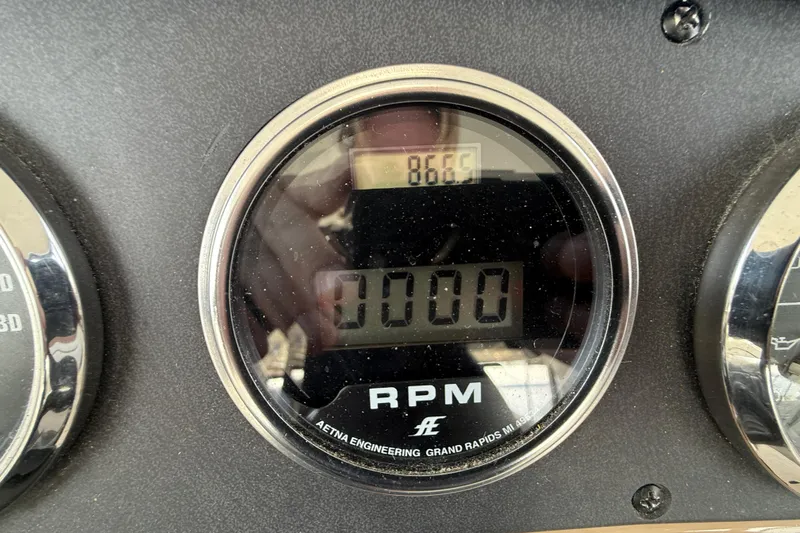 One Last Time II Yacht Photos Pics Close-up of RPM gauge on 2004 Carver 444 Cockpit Motor Yacht dashboard.