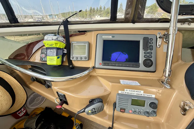 One Last Time II Yacht Photos Pics 2004 Carver 444 Cockpit Motor Yacht dashboard with navigation equipment and controls.