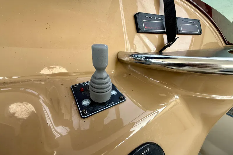 One Last Time II Yacht Photos Pics Control panel of 2004 Carver 444 Cockpit Motor Yacht with joystick and Volvo Penta displays.