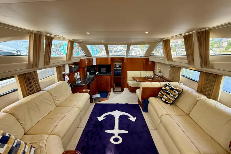 One Last Time II Yacht Photos Pics Luxurious interior of 2004 Carver 444 Cockpit Motor Yacht with plush seating and nautical decor.