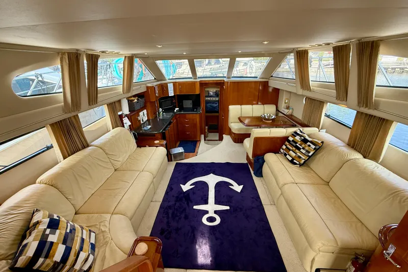 One Last Time II Yacht Photos Pics Luxurious interior of 2004 Carver 444 Cockpit Motor Yacht with plush seating and nautical decor.