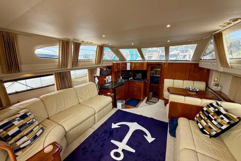 One Last Time II Yacht Photos Pics Luxurious interior of 2004 Carver 444 Cockpit Motor Yacht with plush seating and nautical decor.