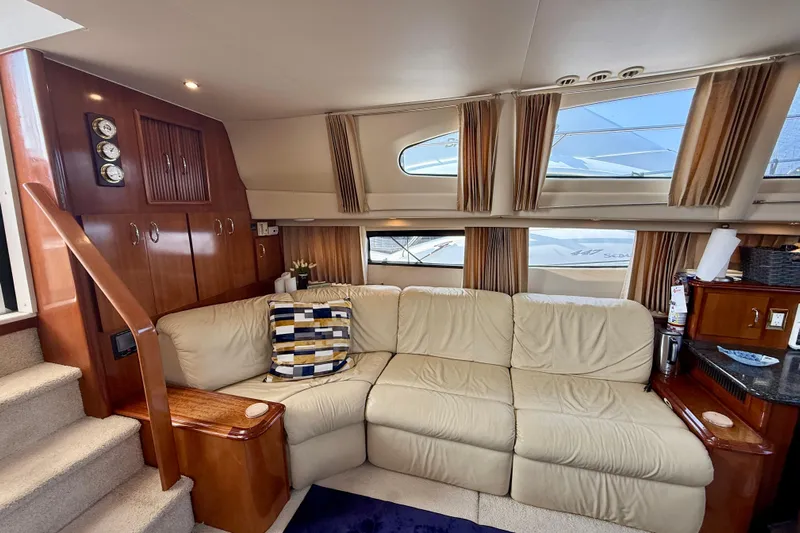 One Last Time II Yacht Photos Pics Luxurious interior of 2004 Carver 444 Cockpit Motor Yacht with plush seating and elegant wood finishes.