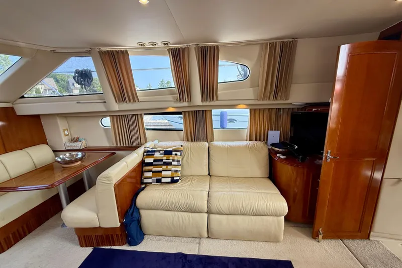 One Last Time II Yacht Photos Pics Luxurious interior of 2004 Carver 444 Cockpit Motor Yacht with plush seating and elegant decor.