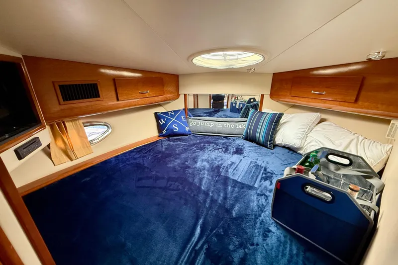 One Last Time II Yacht Photos Pics Cozy cabin interior of 2004 Carver 444 Cockpit Motor Yacht with plush bedding.