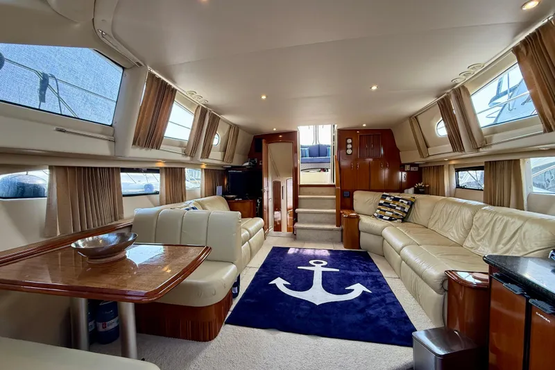 One Last Time II Yacht Photos Pics Luxurious interior of 2004 Carver 444 Cockpit Motor Yacht with plush seating and nautical decor.