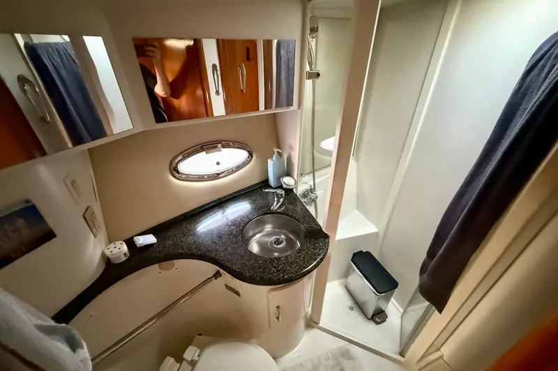 One Last Time II Yacht Photos Pics Bathroom interior of 2004 Carver 444 Cockpit Motor Yacht with sink and shower.