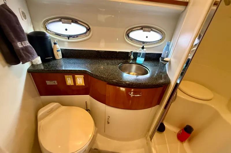 One Last Time II Yacht Photos Pics Luxurious bathroom in 2004 Carver 444 Cockpit Motor Yacht with modern amenities.