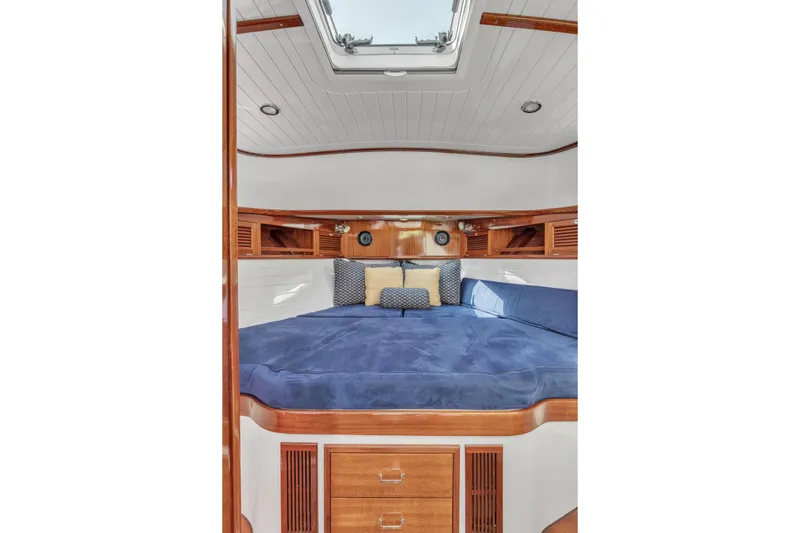 Ingrid Yacht Photos Pics Luxurious cabin interior of 2007 Gorbon Custom Downeast 40 yacht with blue bedding.