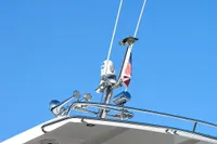 2024 Nimbus Commuter 11 boat roof with antennas against clear blue sky.