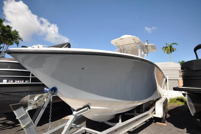  Yacht Photos Pics 2020 SeaVee 290B boat on trailer under clear blue sky.