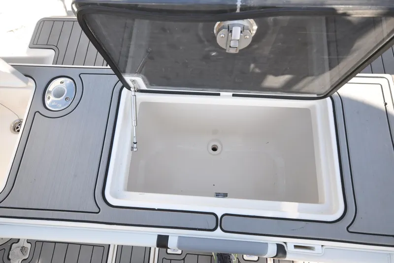  Yacht Photos Pics 2020 SeaVee 290B boat storage compartment with open lid, showcasing interior space.