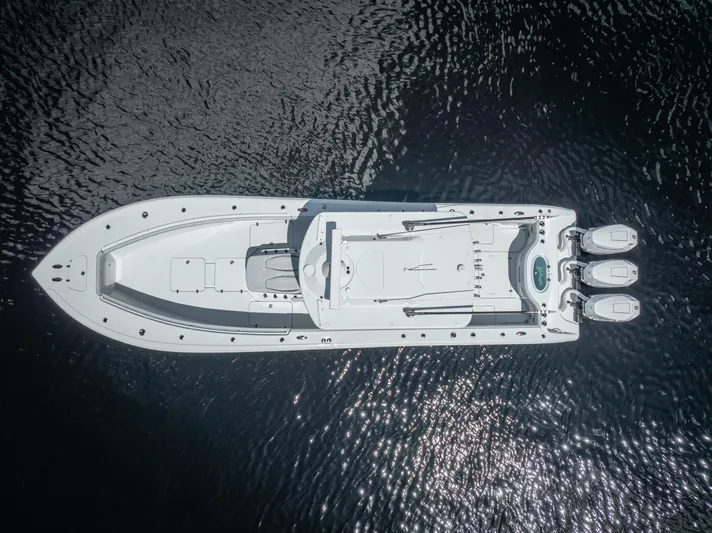  Yacht Photos Pics Aerial view of 2025 Yellowfin 36 boat on dark water.