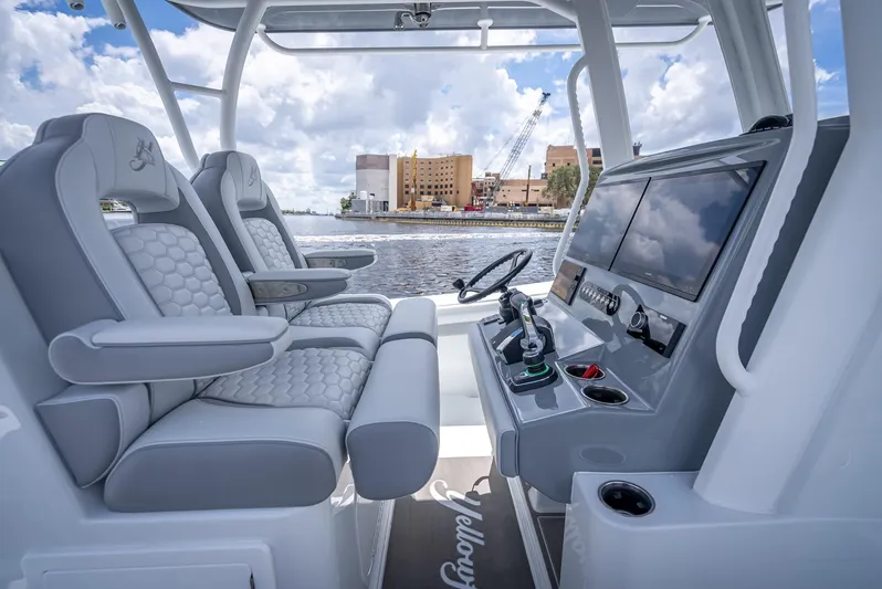  Yacht Photos Pics 2025 Yellowfin 36 boat interior with luxurious seating and advanced navigation system.