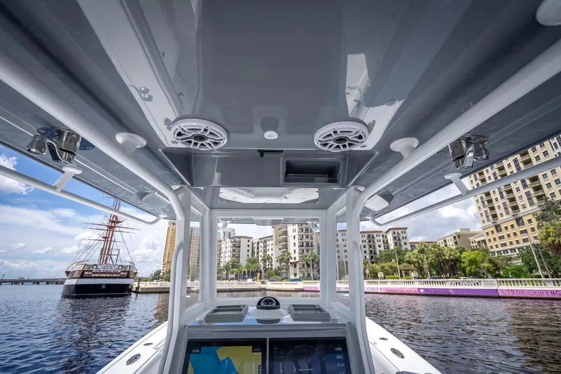  Yacht Photos Pics 2025 Yellowfin 36 boat interior with modern navigation system and waterfront view.