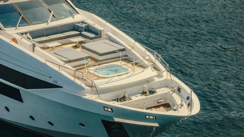 Charisma Yacht Photos Pics Luxury Benetti Fast 125 yacht, 2015 model, featuring spacious deck and jacuzzi on open sea.