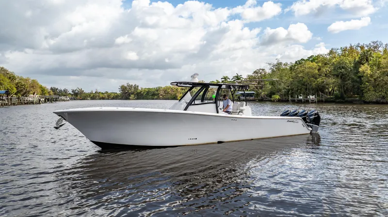 Catahoula Yacht Photos Pics 2023 Front Runner 39 Center Console boat cruising on a scenic river.