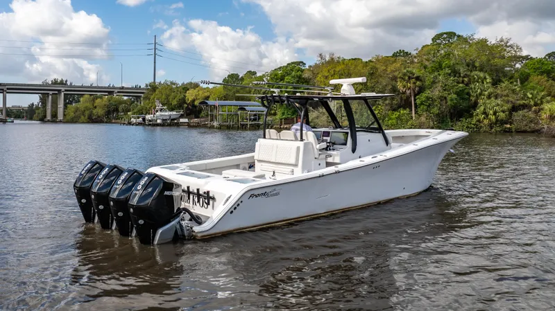 Catahoula Yacht Photos Pics 2023 Front Runner 39 Center Console boat on a river with four outboard engines.