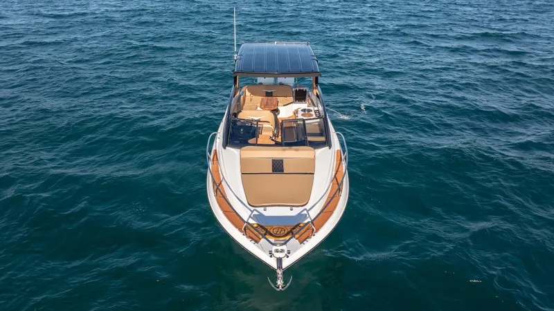  Yacht Photos Pics 2025 Hanover 305 boat on open water, aerial view.