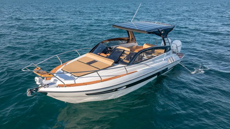  Yacht Photos Pics Luxurious 2025 Hanover 305 yacht cruising on open water.