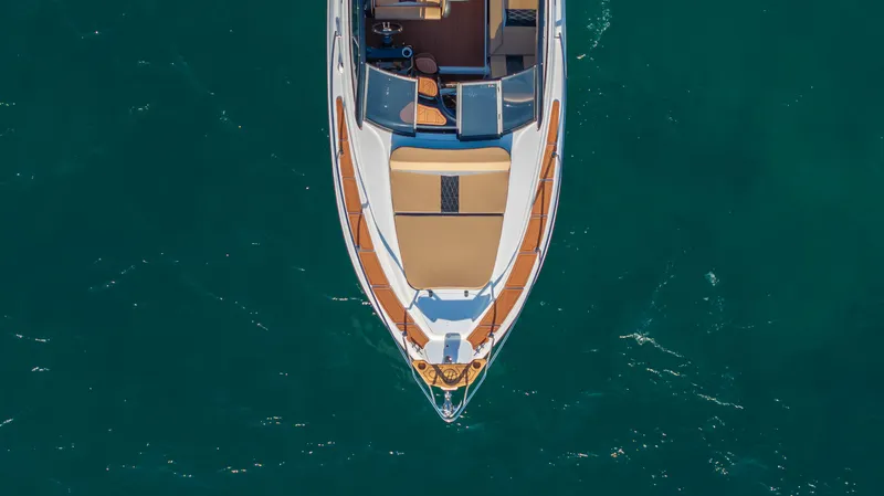  Yacht Photos Pics Aerial view of 2025 Hanover 305 yacht on turquoise water.